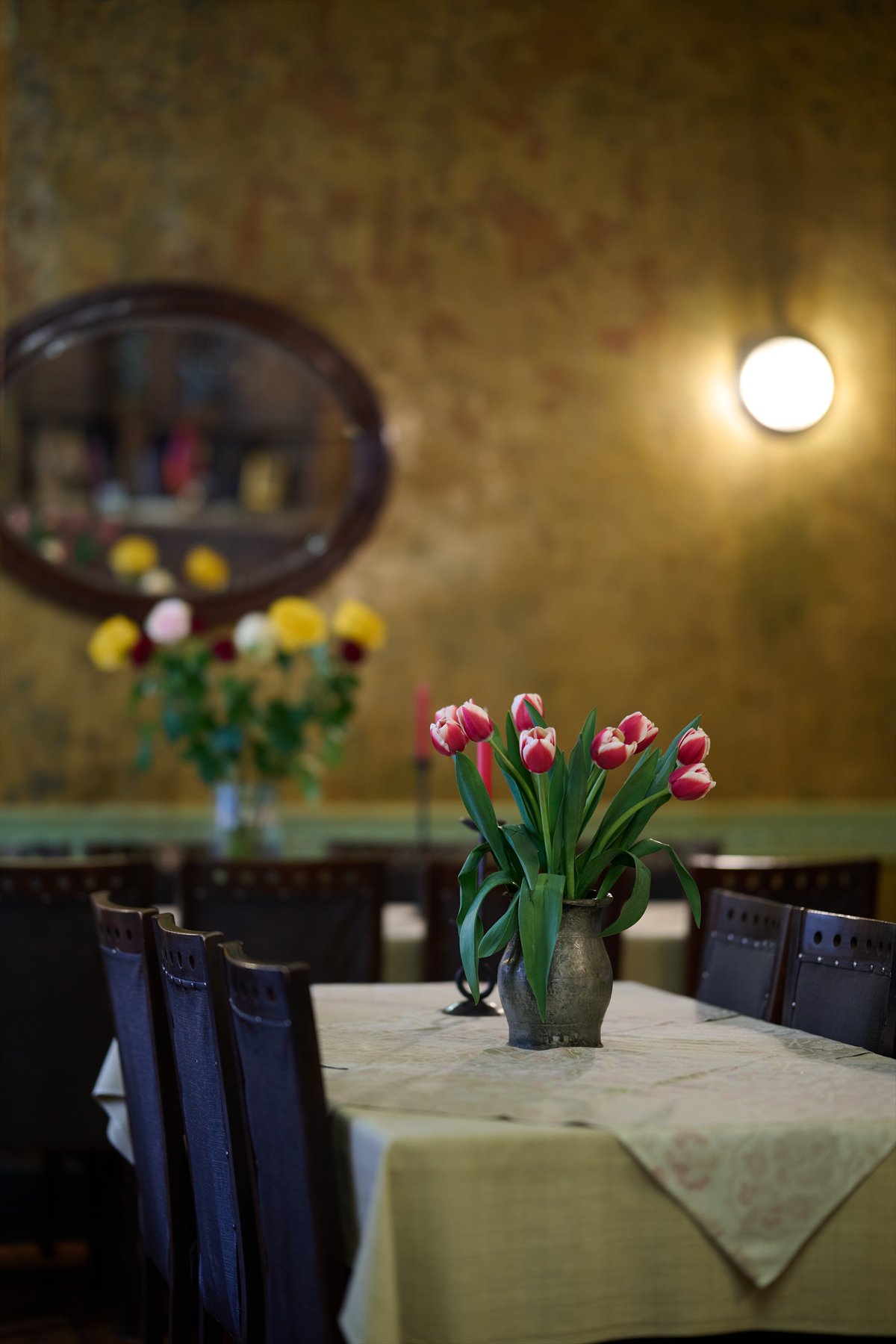Tulips on a dining table in Dolmama's golden room