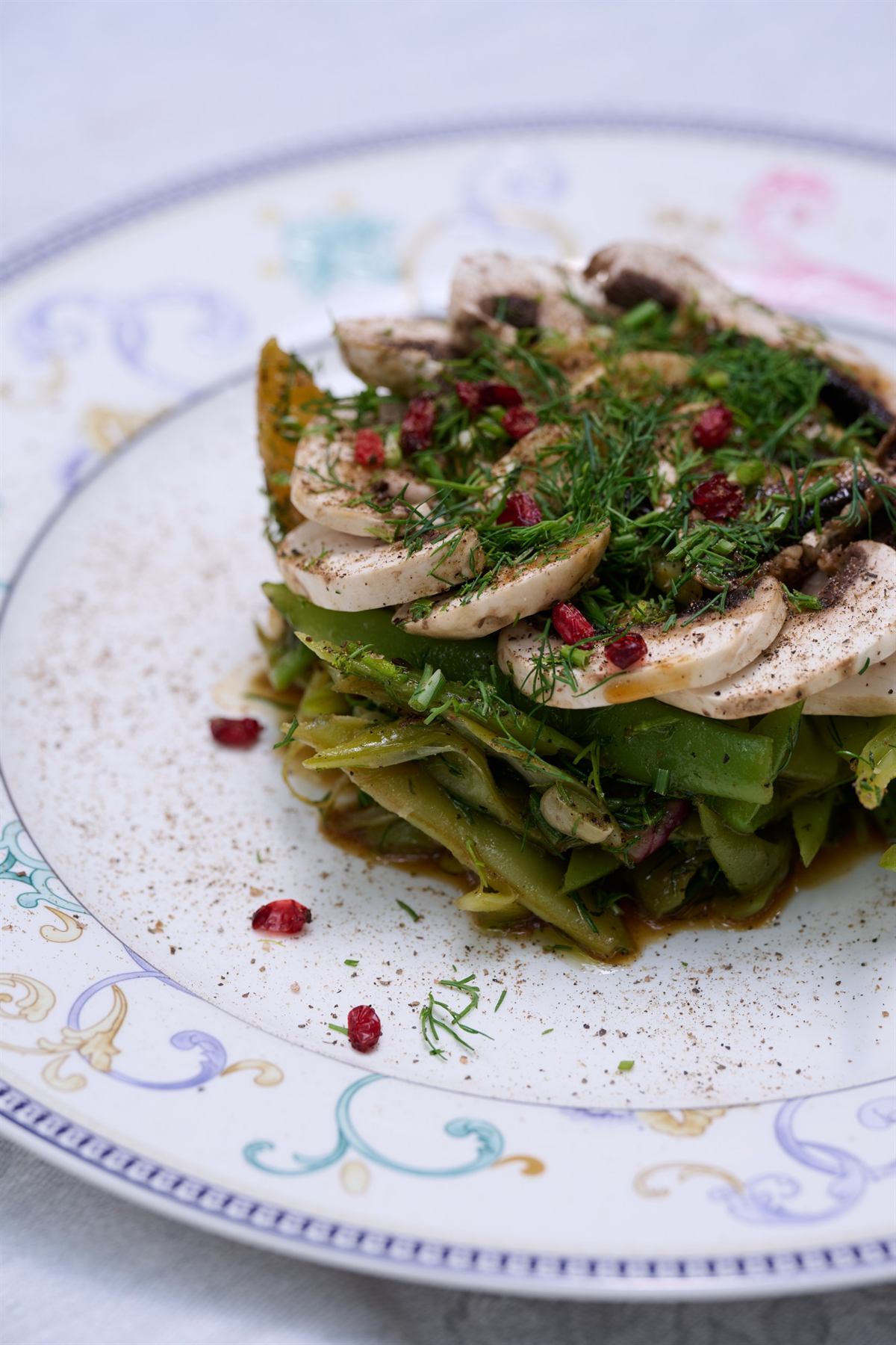 Seasonal mushroom and herb salad on decorated plate