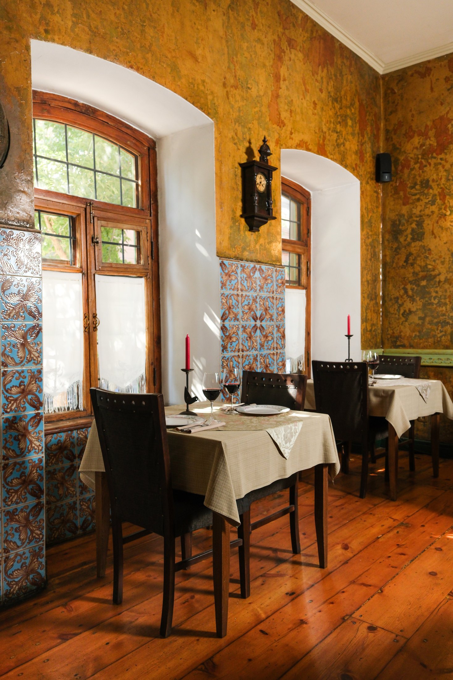 Dolmama dining room with heritage tiles and set tables